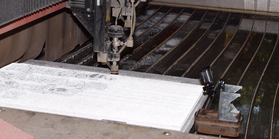 How does waterjet cutting eliminate profiling processes and increase efficiency?